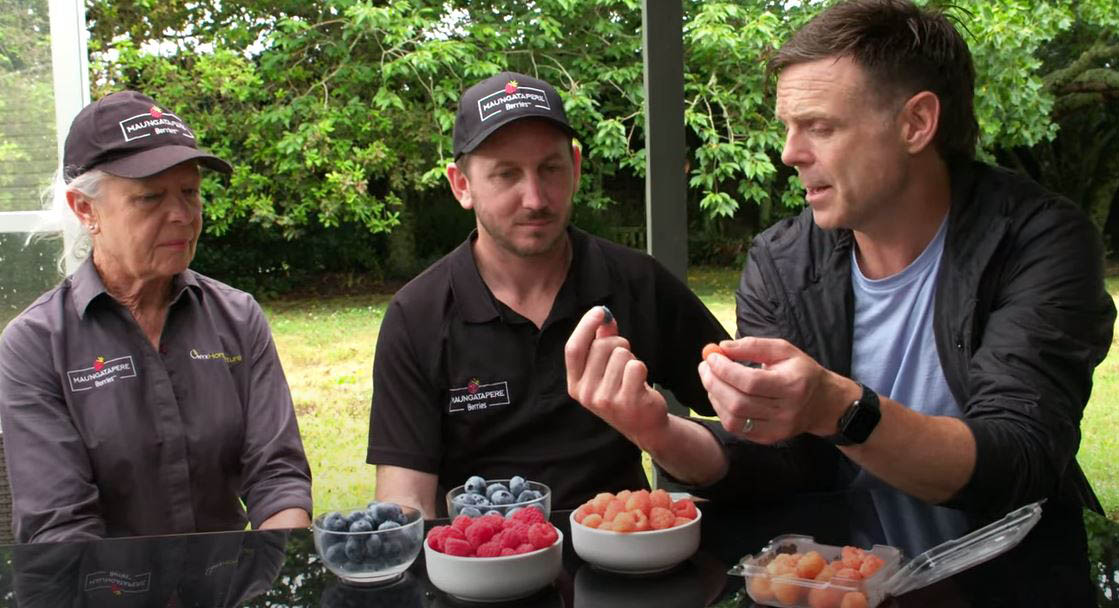 Mangatapere orchard owners with Ben Bayly enjoying berries